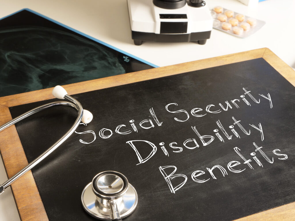 Social Security Disability Benefits are shown written on a small blackboard