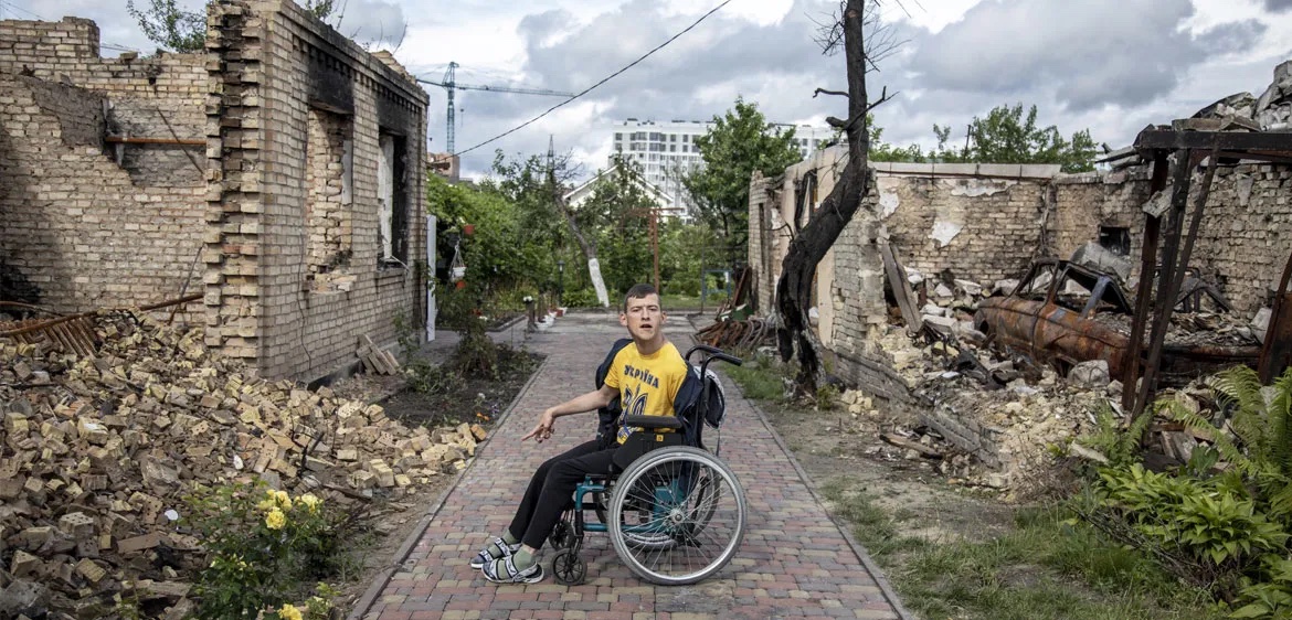 Man in Wheelchair in War Zone copy