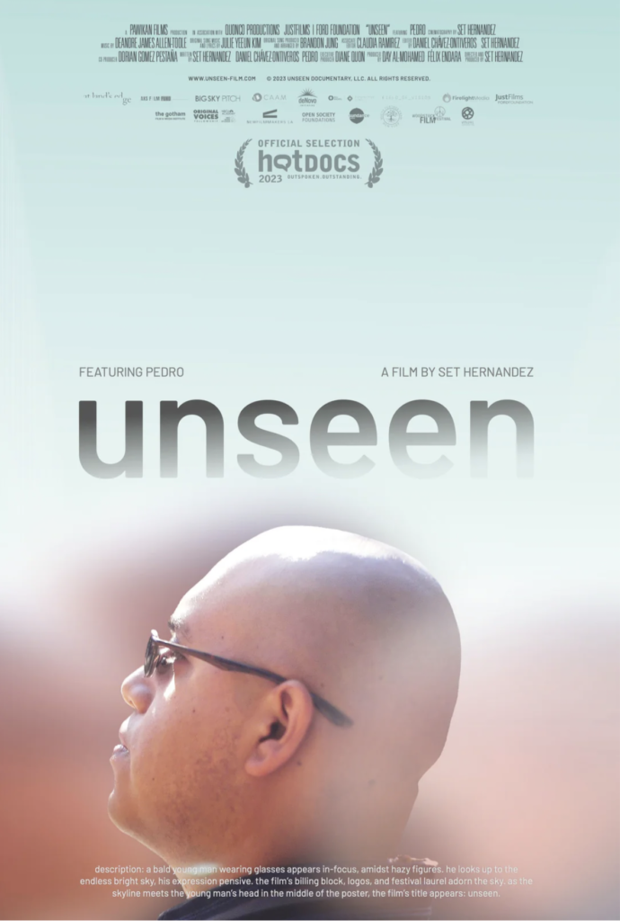 The movie poster for the documentary film "Unseen". A man is pictured from the side, wearing sunglasses. he has a shaved head. 