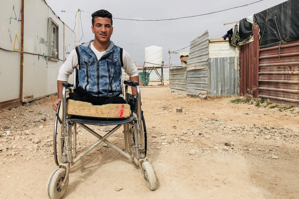 Man with limb loss (legs) using a wheelchair